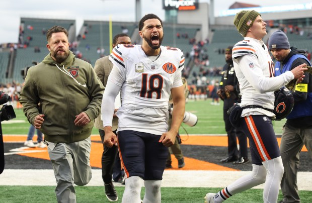 Bears quarterback Caleb Williams yells in celebration after a 47-42...