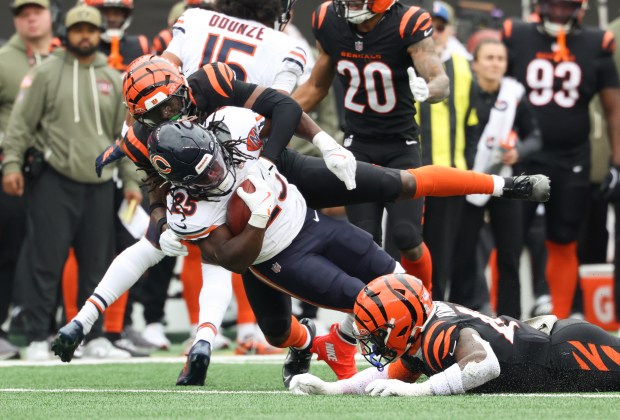 Bears running back Kyle Monangai (25) is tackled on a...
