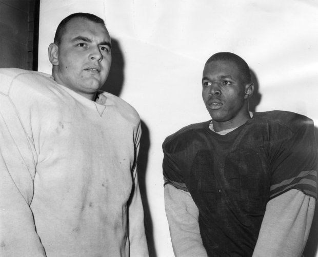 Defensive and offensive rookies of the year, Dick Butkus, left, and Gale Sayers at Wrigley Field on Dec. 16, 1965. (Chicago Tribune historical photo)