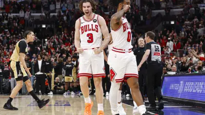 Nov 22, 2025; Chicago, Illinois, USA; Chicago Bulls guard Josh Giddey (3) and guard Coby White (0) celebrate a defensive stop against the Washington Wizards during the second half at United Center.