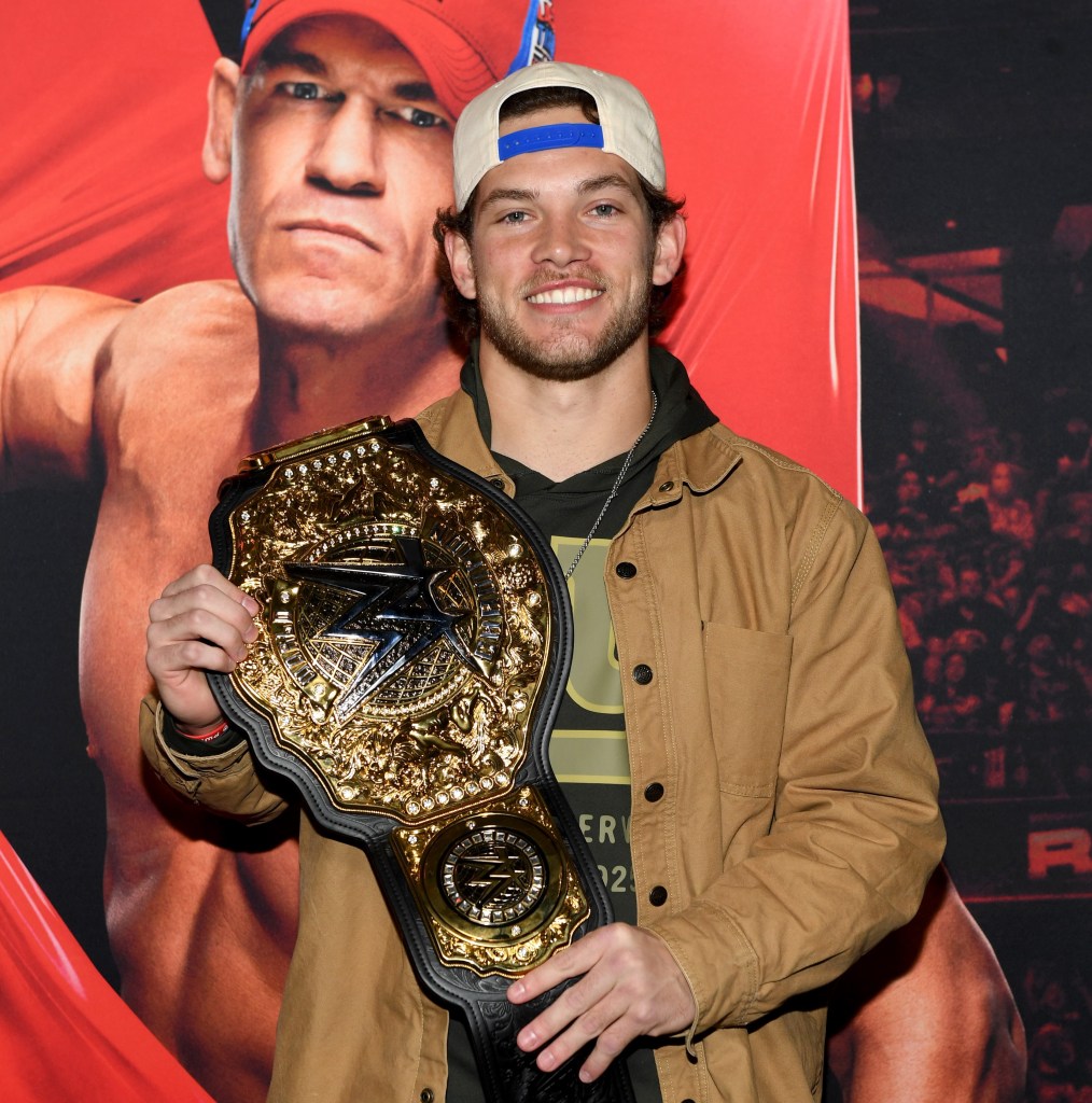 Giants rookie wide receiver Dalen Cambre takes a picture with a WWE championship belt during Monday Night RAW at Madison Square Garden on Nov. 17, 2025.