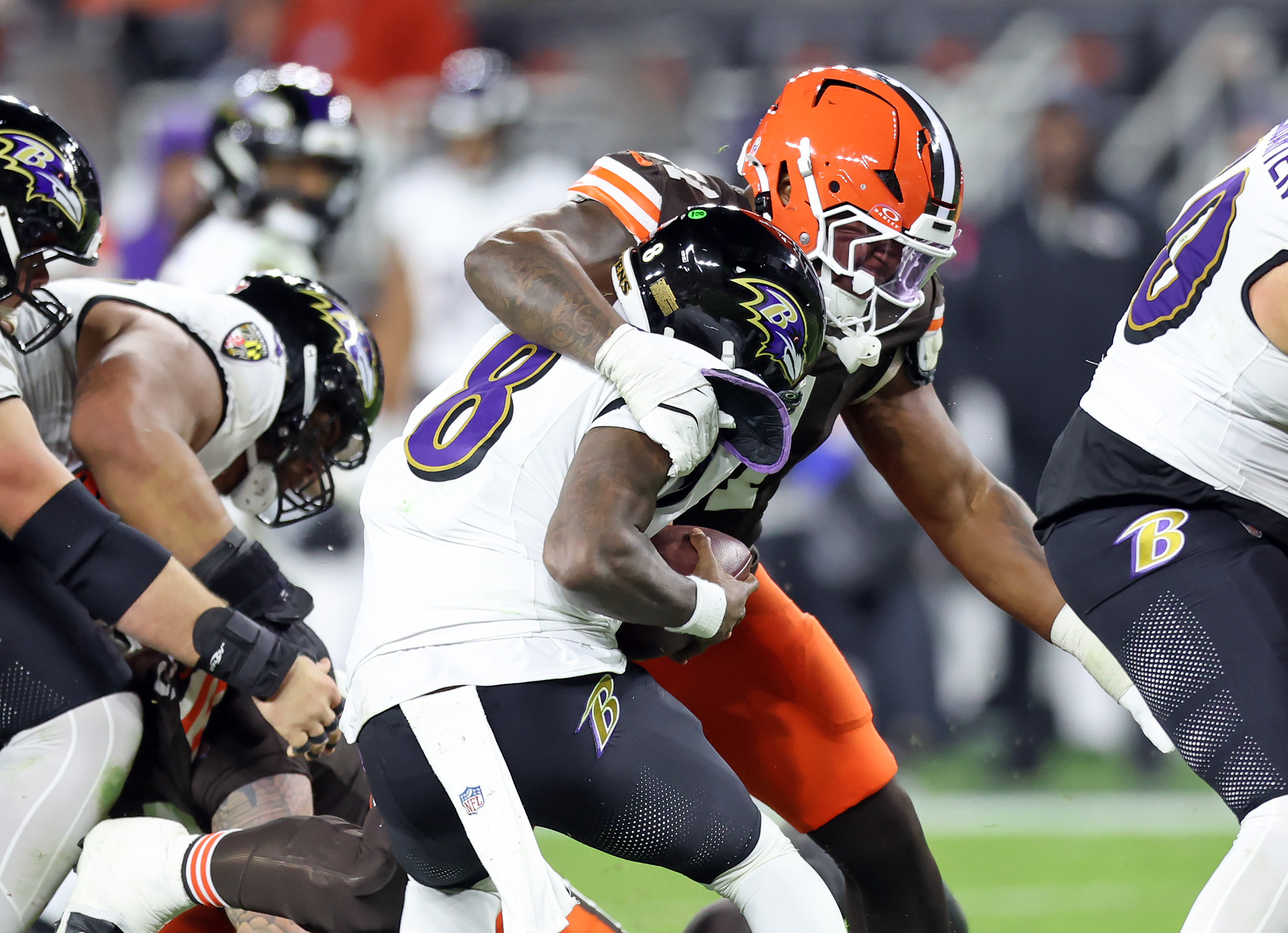 Cleveland Browns defensive tackle Mike Hall Jr. sacks Baltimore Ravens quarterback Lamar Jackson in the second half of play. 