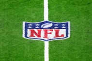 An NFL logo is seen on the field before an NFL football game between the Houston Texans and...