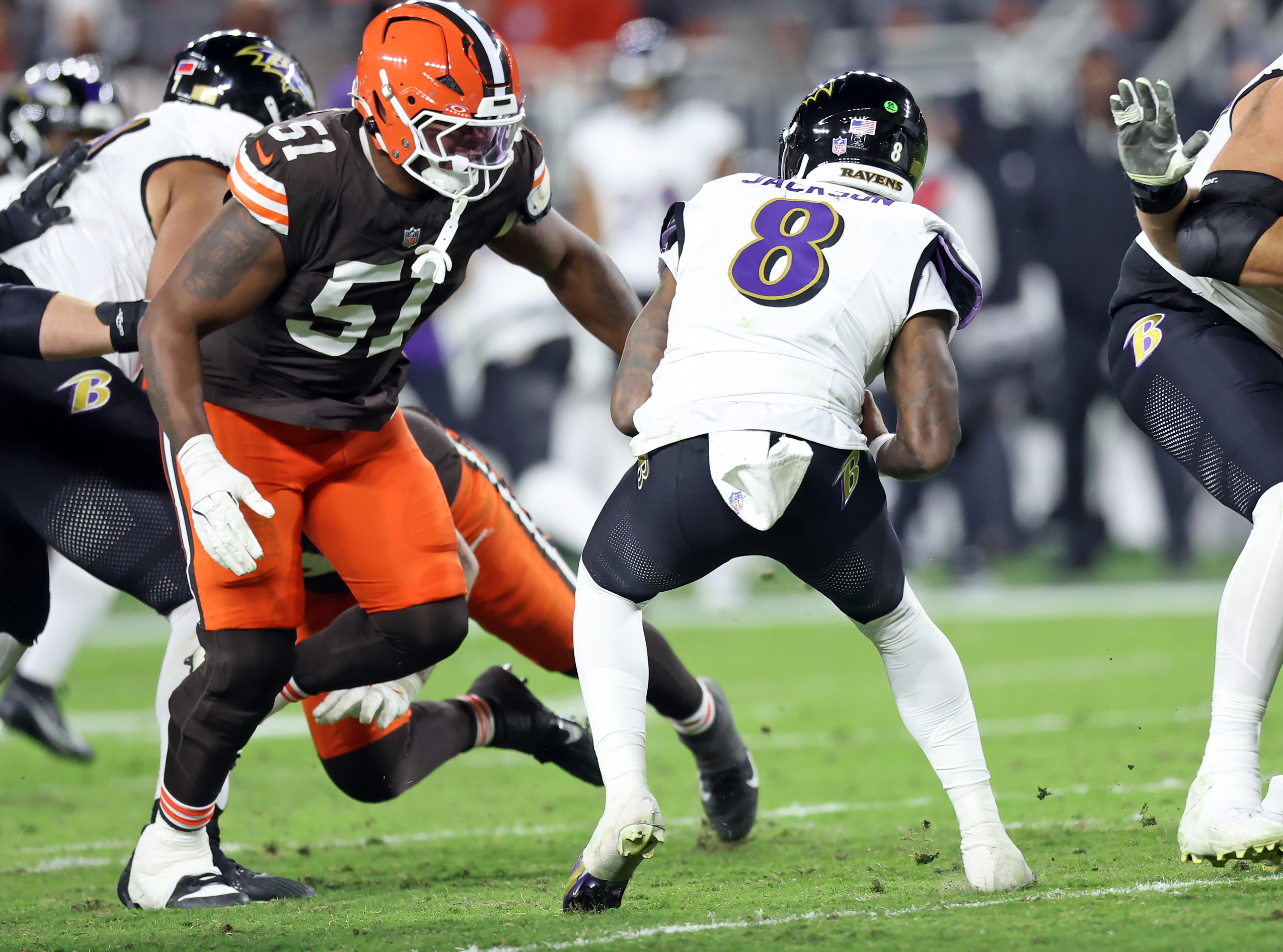 Cleveland Browns defensive tackle Mike Hall Jr. sacks Baltimore Ravens quarterback Lamar Jackson in the second half of play. 