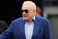 Dallas Cowboys team owner Jerry Jones walks on the field during warmups before an NFL...