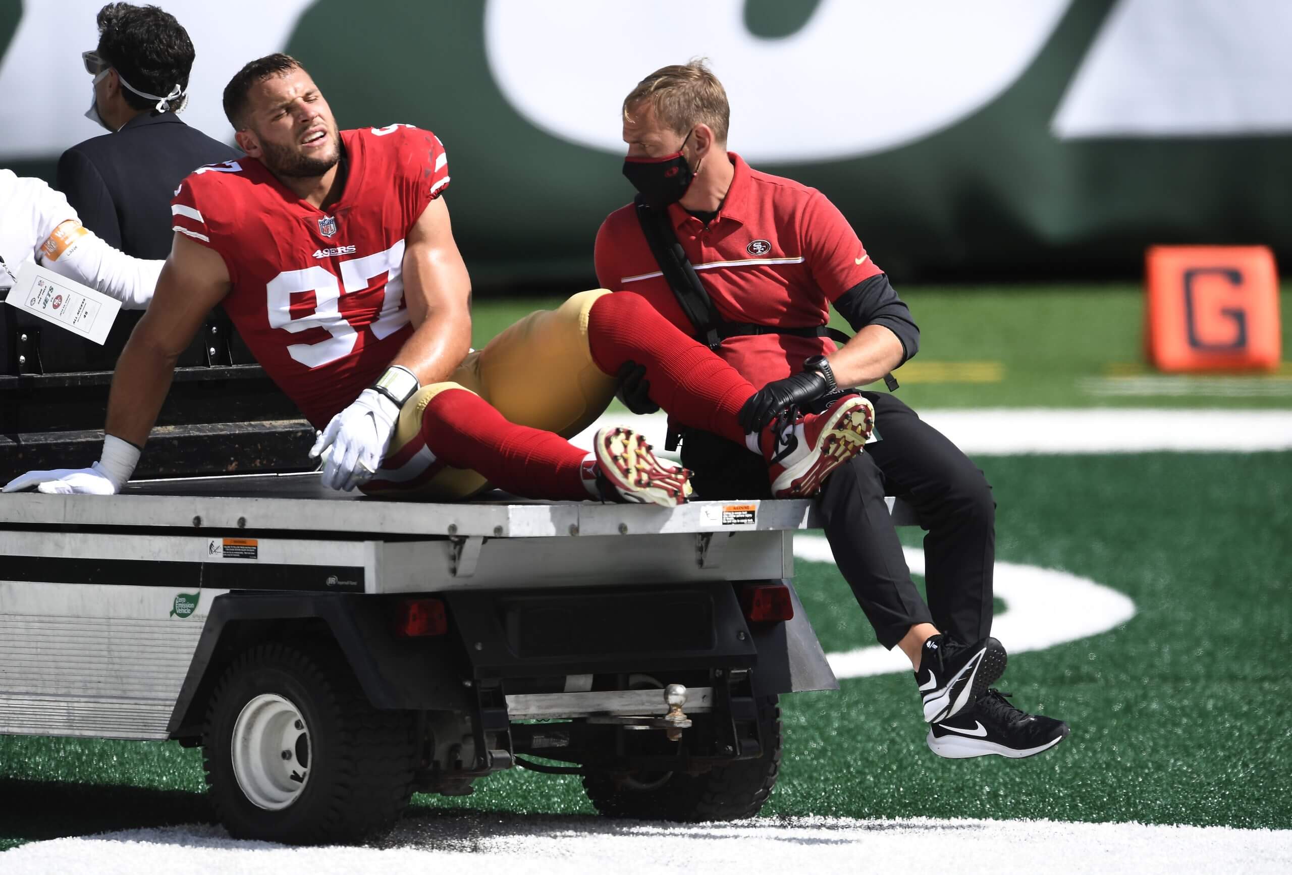 Nick Bosa of the 49ers leaves a 2020 game against the New York Jets after injuring his knee.