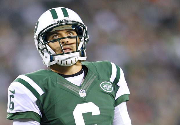 Quarterback Mark Sanchez of the New York Jets walks off the field after his fumble resulted in a touchdown by the New England Patriots during the second quarter of a game at MetLife Stadium on Nov. 22, 2012, in East Rutherford, New Jersey. The Patriots defeated the Jets 49-19. (Photo by Rich Schultz /Getty Images)