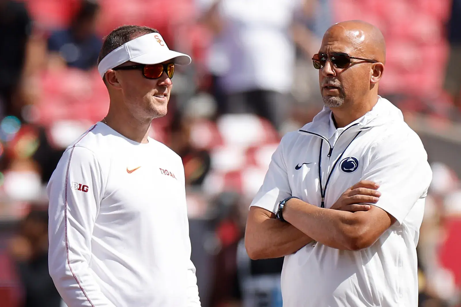 College football head coach Lincoln Riley of the USC Trojans talks with Head coach James Franklin of the Penn State Nittany Lions