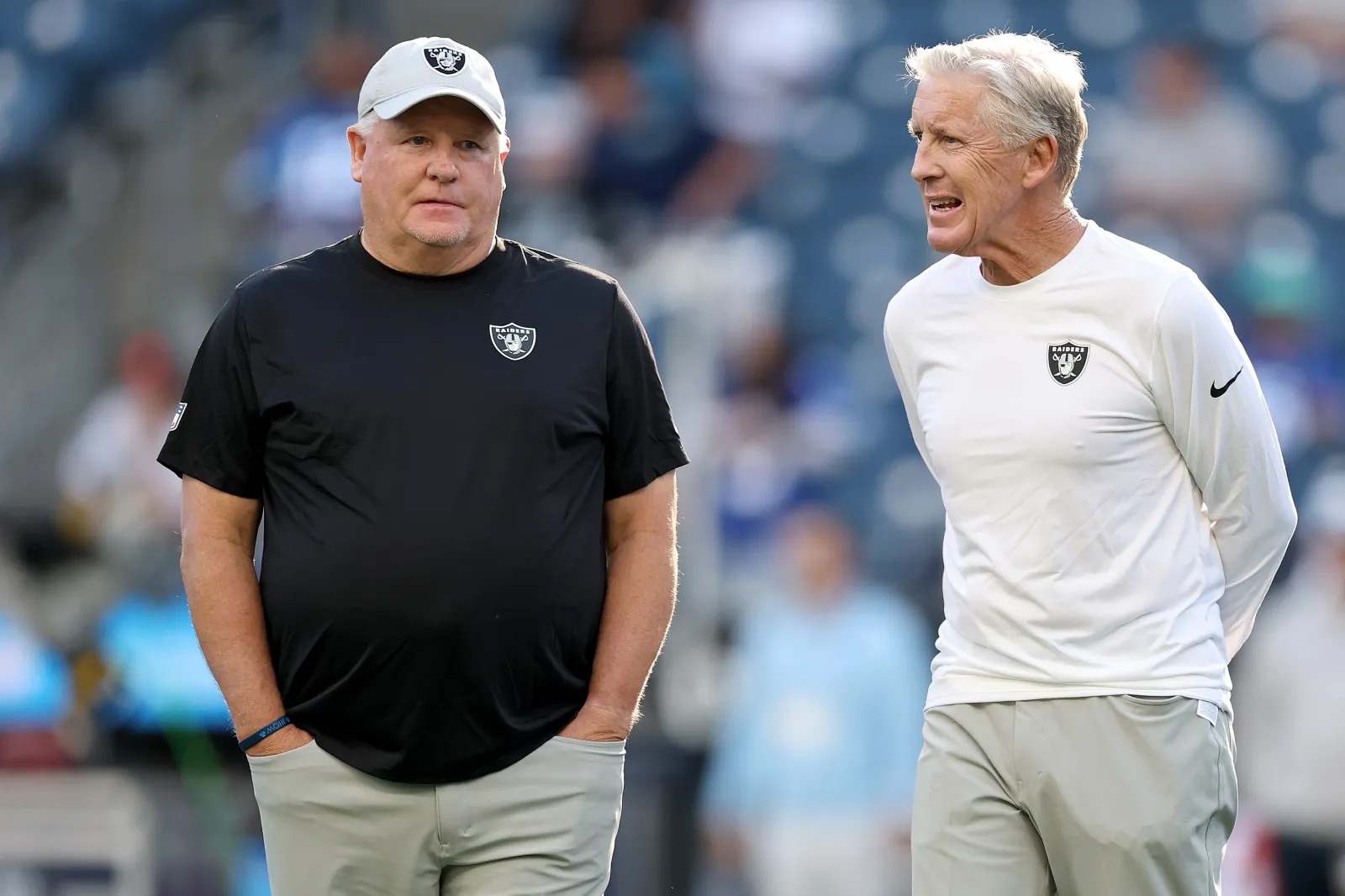 Offensive coordinator Chip Kelly and head coach Pete Carroll of the Las Vegas Raiders