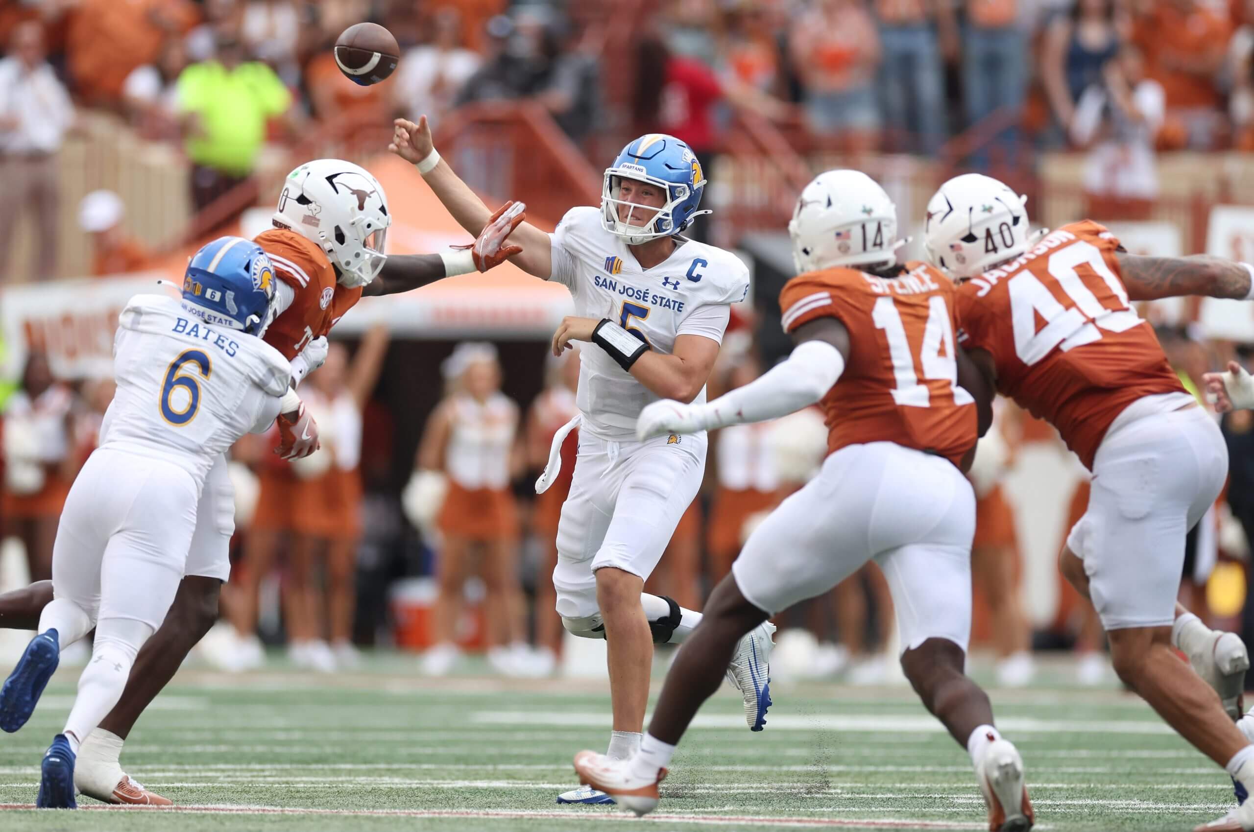Walker Eget #5 of the San Jose State Spartans thows a pass against Anthony Hill Jr. #0 of the Texas Longhorns in the second half at Darrell K Royal-Texas Memorial Stadium