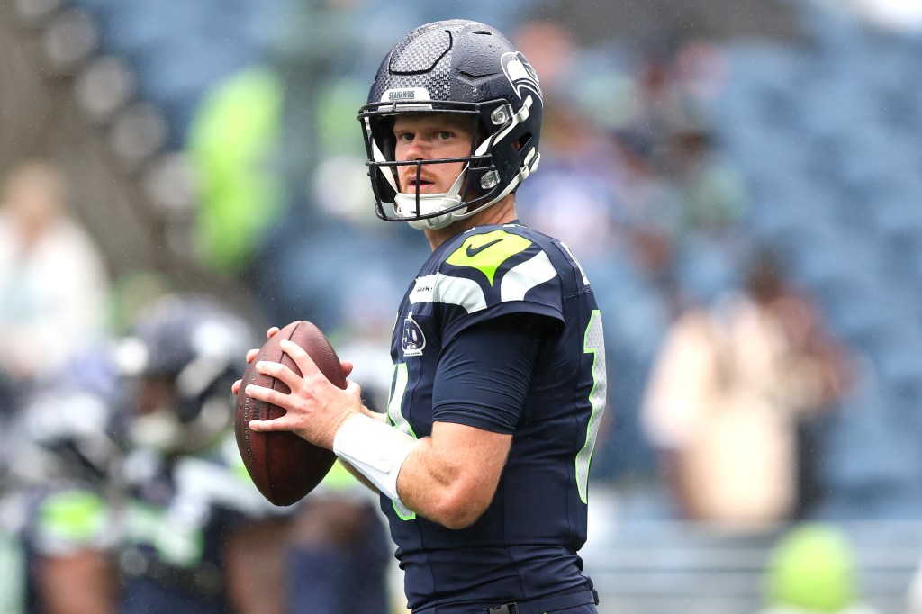 SEATTLE, WASHINGTON - SEPTEMBER 21: Sam Darnold #14 of the Seattle Seahawks warms up before the game against the New Orleans Saints at Lumen Field on September 21, 2025 in Seattle, Washington. (Photo by Steph Chambers/Getty Images)