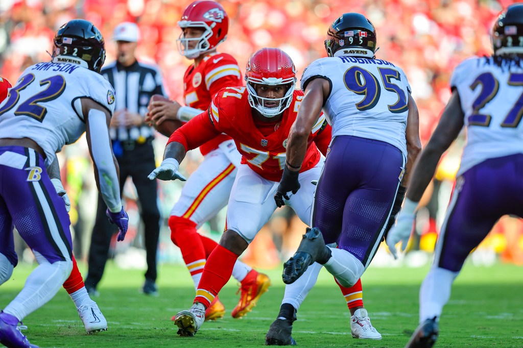 Josh Simmons #71 of the Kansas City Chiefs prepares to block Tavius Robinson #95 of the Baltimore Ravens in the second quarter on September 28, 2025.