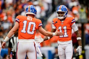 DENVER, COLORADO - OCTOBER 26: Troy Franklin #11 of the Denver Broncos celebrates his first quarter tocudown with Bo Nix #10 in a game against the Dallas Cowboys at Empower Field at Mile High on October 26, 2025 in Denver, Colorado. (Photo by Dustin Bradford/Getty Images)
