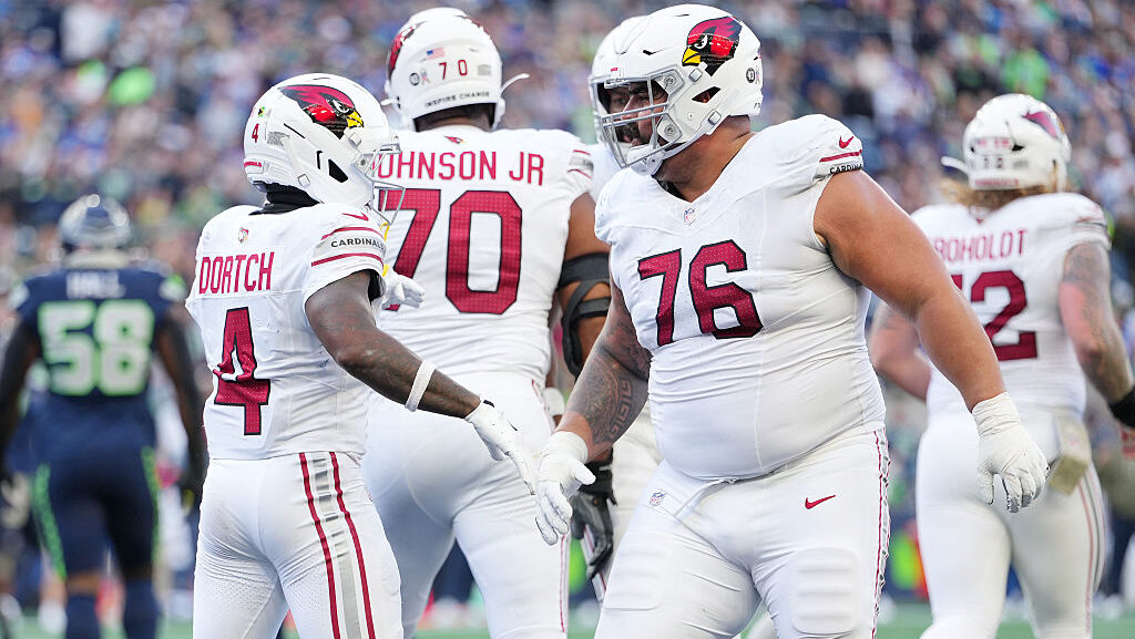 Greg Dortch #4 and Will Hernandez #76 of the Arizona Cardinals celebrate after Dortch's rushing tou...