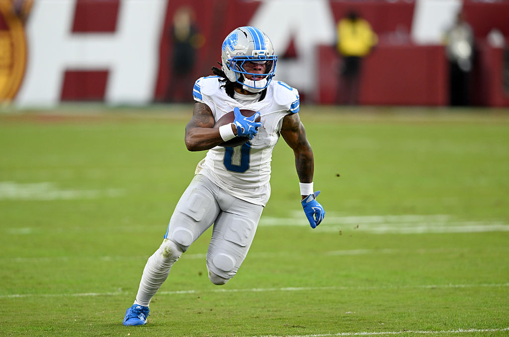 LANDOVER, MARYLAND - NOVEMBER 09: Jahmyr Gibbs #0 of the Detroit Lions rushes the ball against the Washington Commanders at Northwest Stadium on November 09, 2025 in Landover, Maryland. (Photo by G Fiume/Getty Images)