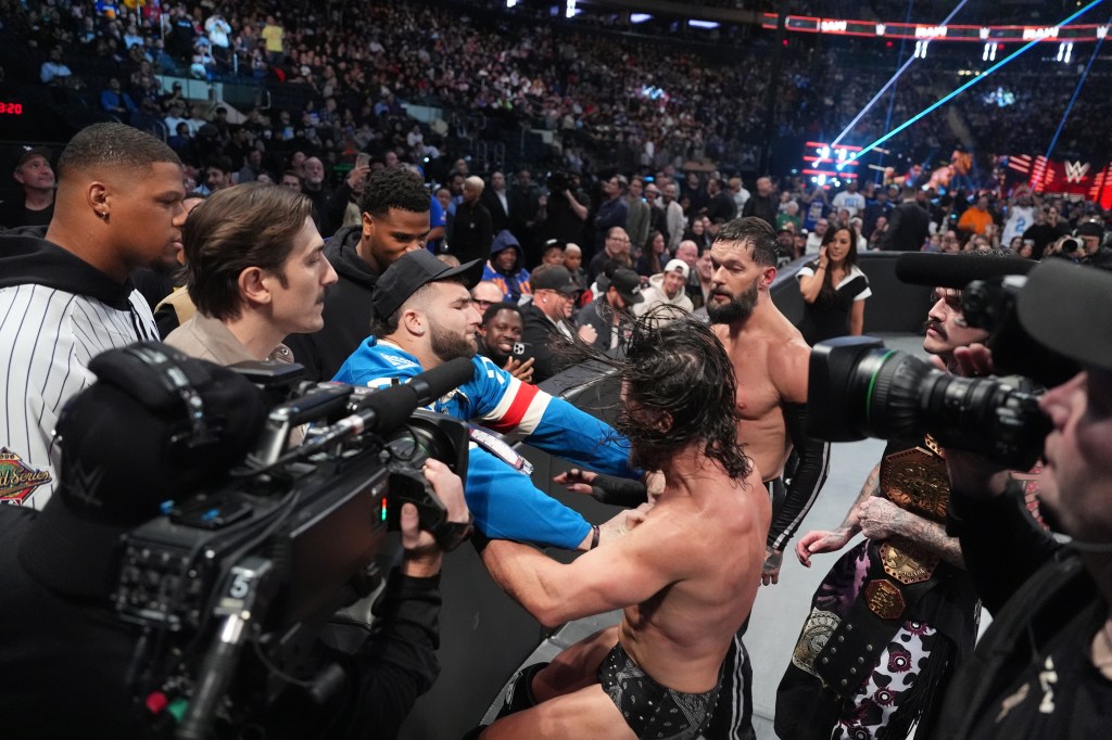 Cam Skattebo hits JD McDonagh during Monday Night RAW at Madison Square Garden on November 17, 2025 in New York City.