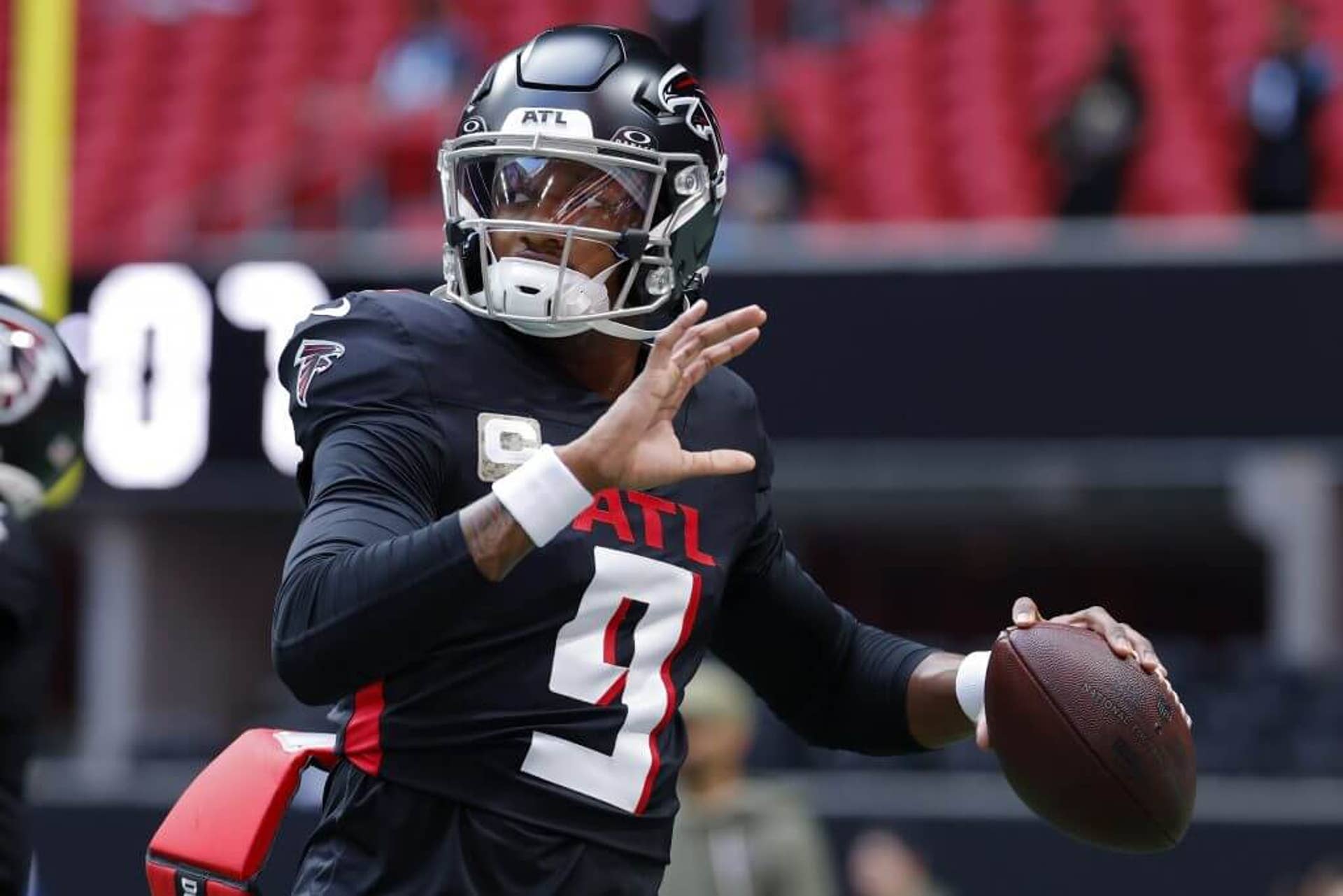 Michael Penix Jr. of the Atlanta Falcons warms up prior to the game against the Carolina Panthers.