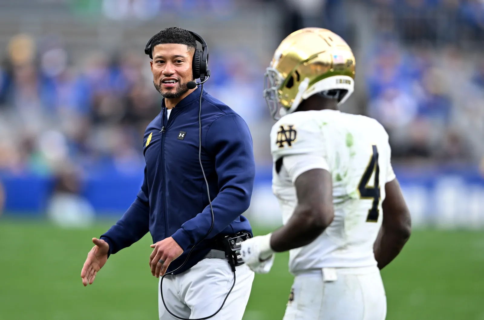 Notre Dame head coach Marcus Freeman with Jeremiyah Love