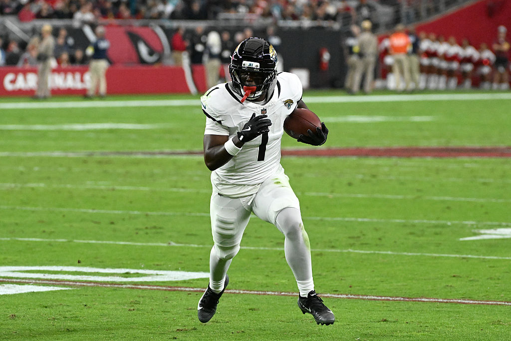 GLENDALE, ARIZONA - NOVEMBER 23: Travis Etienne Jr. #1 of the Jacksonville Jaguars runs for a touchdown in the first quarter against the Arizona Cardinals at State Farm Stadium on November 23, 2025 in Glendale, Arizona. (Photo by Norm Hall/Getty Images)