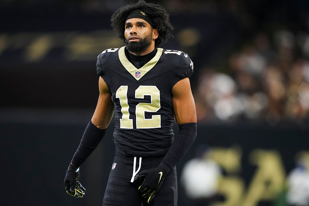 NEW ORLEANS, LOUISIANA - NOVEMBER 23: Chris Olave #12 of the New Orleans Saints looks on from the field during an NFL football game against the Atlanta Falcons at Caesars Superdome on November 23, 2025 in New Orleans, Louisiana. (Photo by Perry Knotts/Getty Images)