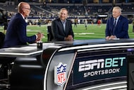 ESPN’s Scott Van Pelt (left) talks with NHL commissioner Gary Bettman (center) and Dallas...