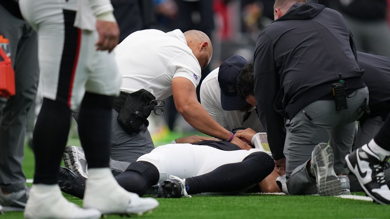 Houston Texans medical staff check on Houston Texans' C.J. Stroud, laying on ground, after Stroud was hit while running the ball in the first half of an NFL football game against the Denver Broncos Sunday, Nov. 2, 2025, in Houston. (AP Photo/Eric Gay)