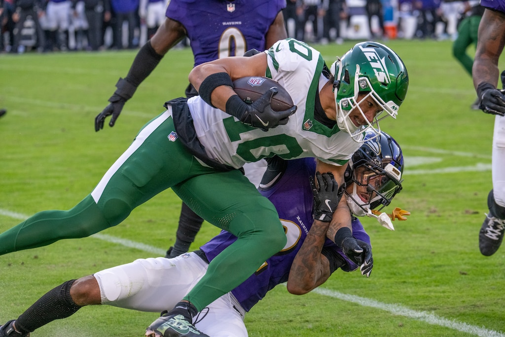 Sunday, Nov. 23, 2025 — Baltimore Ravens cornerback Nate Wiggins (2) tackles New York Jets wide receiver Allen Lazard (10) following a first down reception in 4th quarter against the New York Jets. The Ravens beat the Jets 23-10 at M&T Bank Stadium.