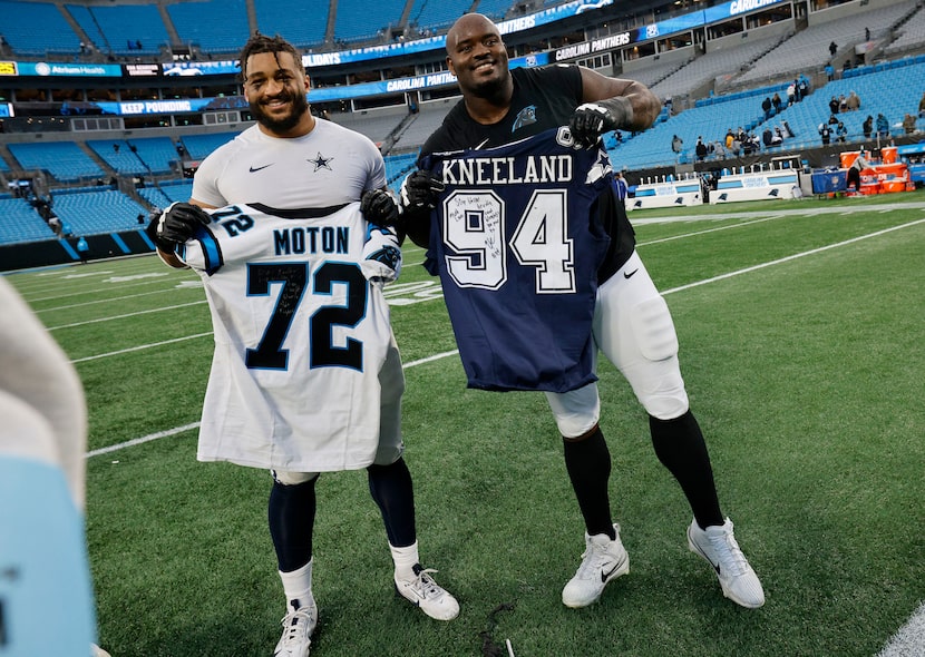 Dallas Cowboys defensive end Marshawn Kneeland, left, and  Carolina Panthers offensive...
