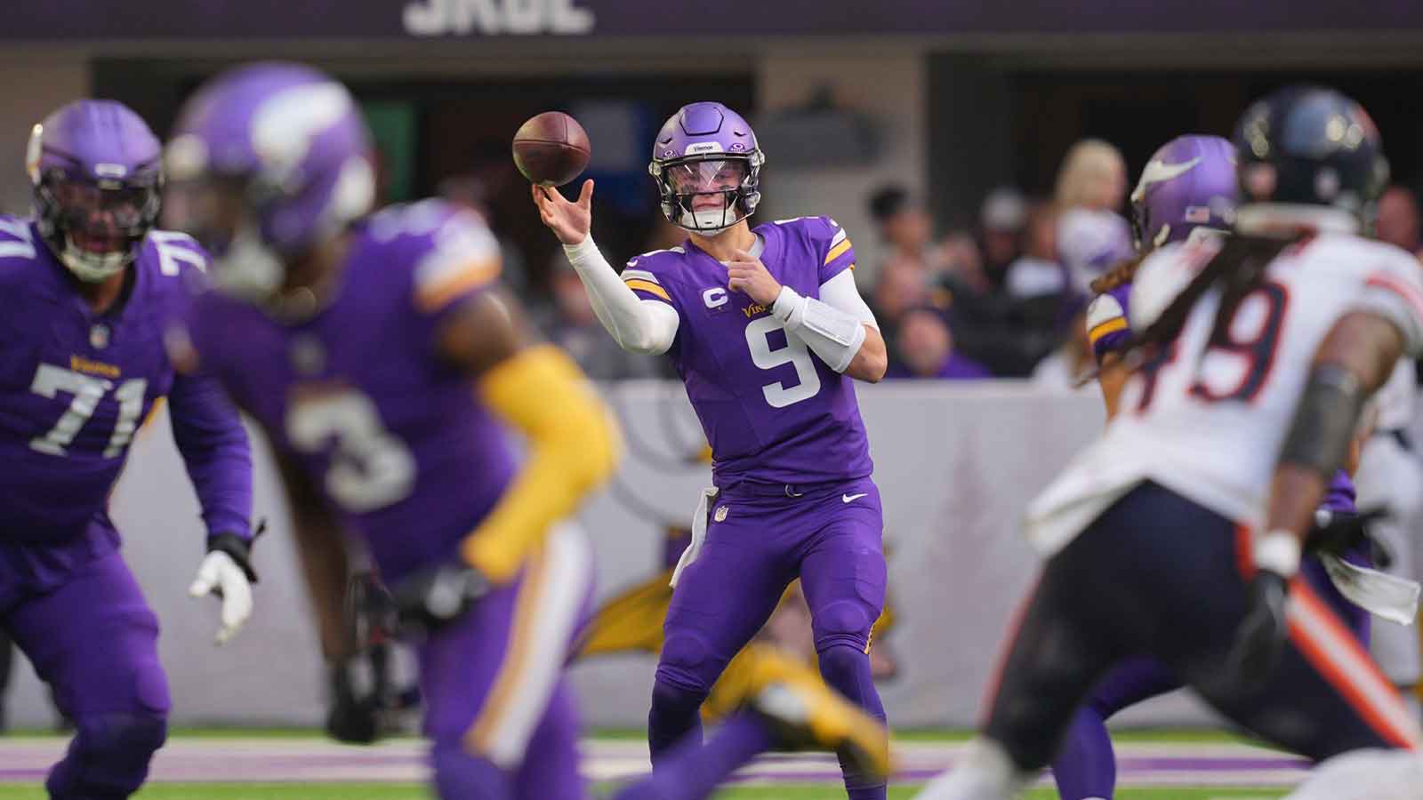 Minnesota Vikings quarterback J.J. McCarthy (9) throws downfield during the first quarter against the Chicago Bears at U.S. Bank Stadium. 
