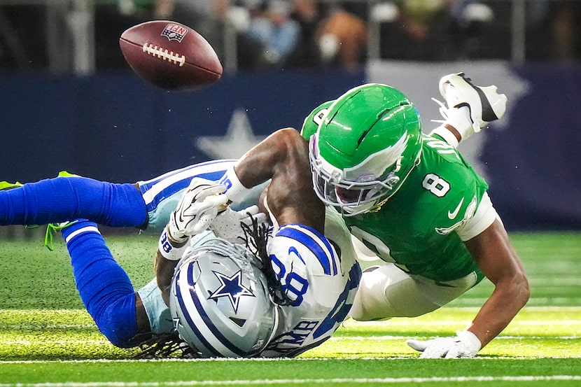 Dallas Cowboys wide receiver Ceedee Lamb (88) loses the football as he is hit by...