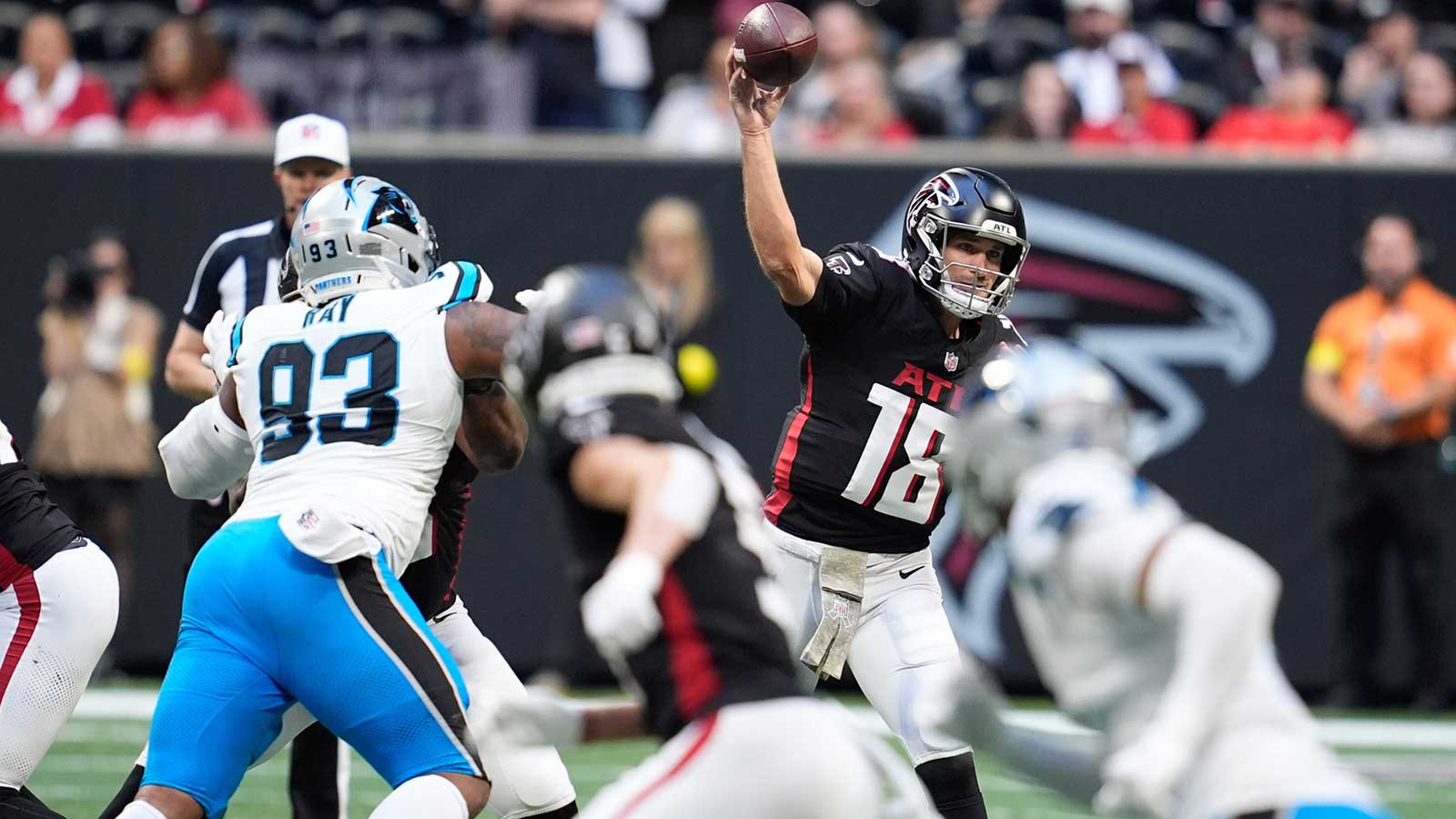 Atlanta Falcons quarterback Kirk Cousins (18) throws the ball in the second half against the Carolina Panthers at Mercedes-Benz Stadium.