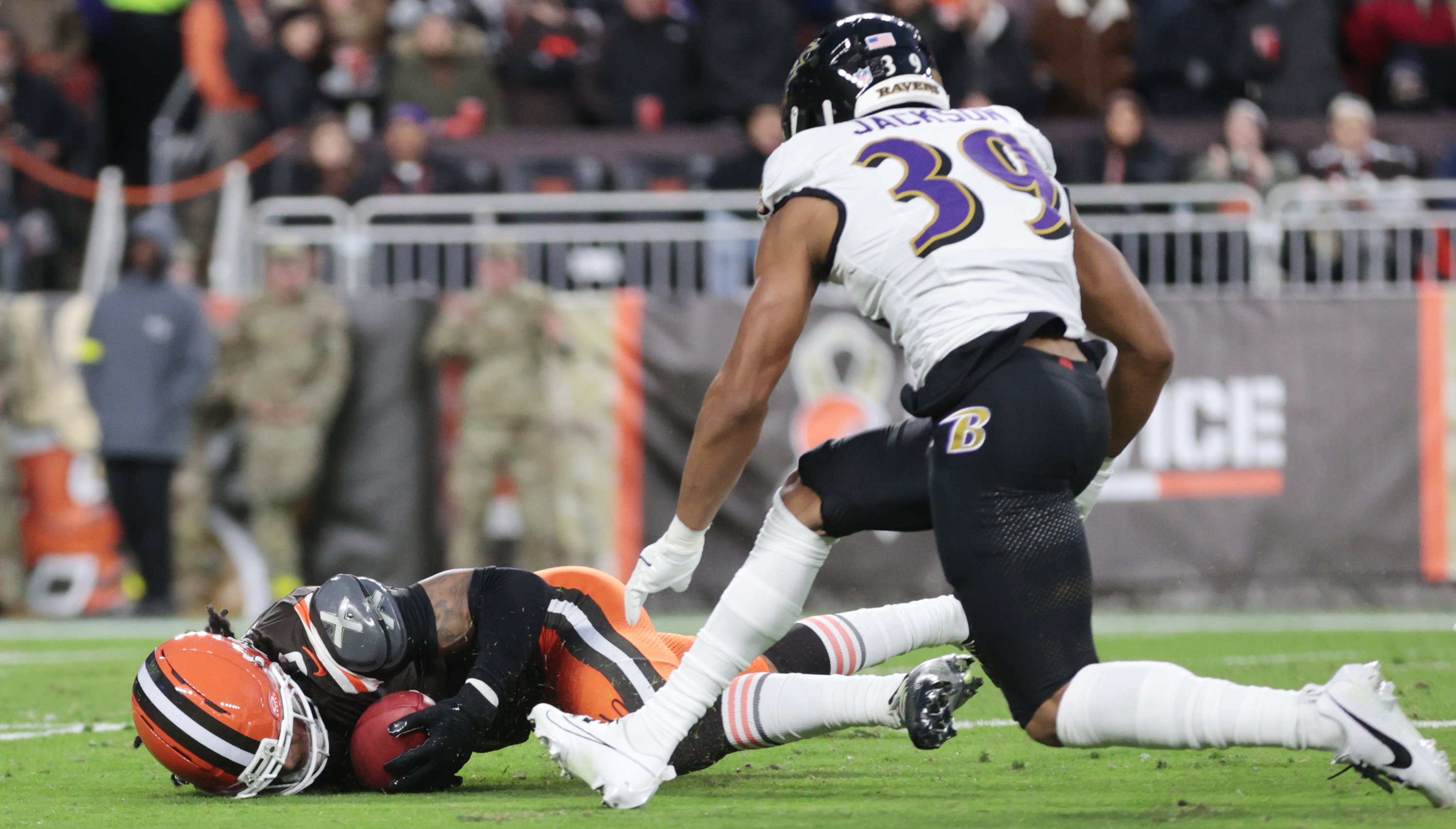 Cleveland Browns safety Grant Delpit dives on a fumbled Baltimore Ravens kick off for a turn over as Baltimore Ravens safety Keondre Jackson completes the tackle in the first half.  