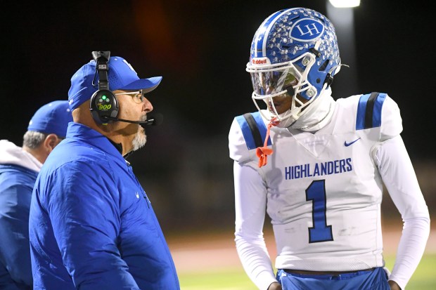 La Habra football coach Frank Mazzotta talks to quarterback DJ...