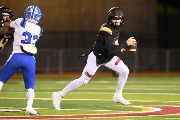 Oaks Christian quarterback Niko Bladow (14) looks to pass against...