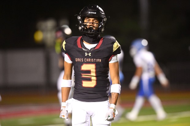 Jaxon Sharp celebrates his first Hal touchdown catch for Oaks...