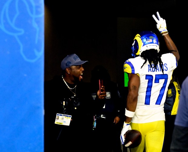 Wide receiver Davante Adams (17) of the Rams runs into...