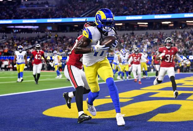 Wide receiver Davante Adams (17) of the Rams catches a...