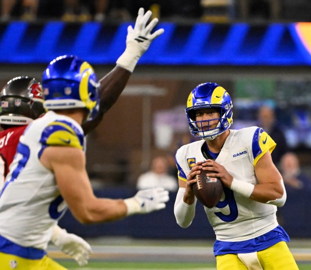 Quarterback Matthew Stafford (9) of the Rams prepares to pass...