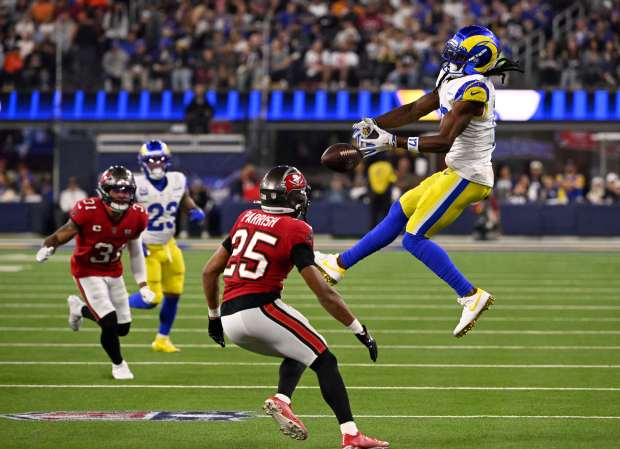 Wide receiver Davante Adams (17) of the Rams drops a...