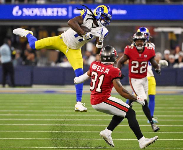 Wide receiver Davante Adams (17) of the Rams catches a...