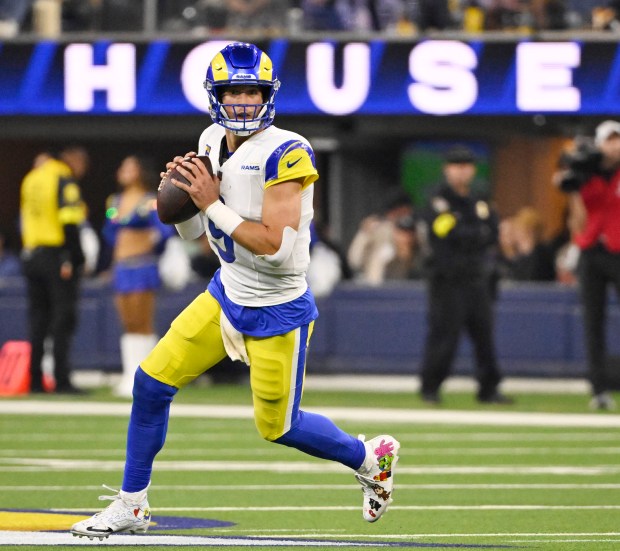 Quarterback Matthew Stafford (9) of the Rams prepares to pass...