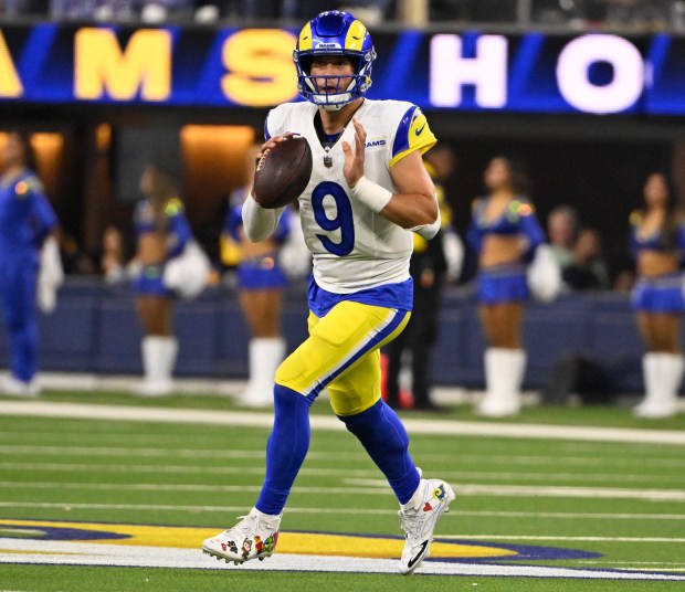Quarterback Matthew Stafford (9) of the Rams prepares to pass...