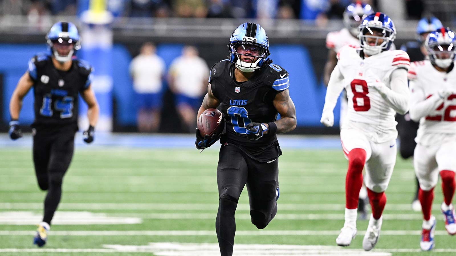 Detroit Lions running back Jahmyr Gibbs (0) runs the ball for a touchdown in over time against the New York Giants at Ford Field.