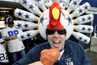 Dallas Cowboys fan Gregg Wilson poses with a turkey leg before an NFL football game against...