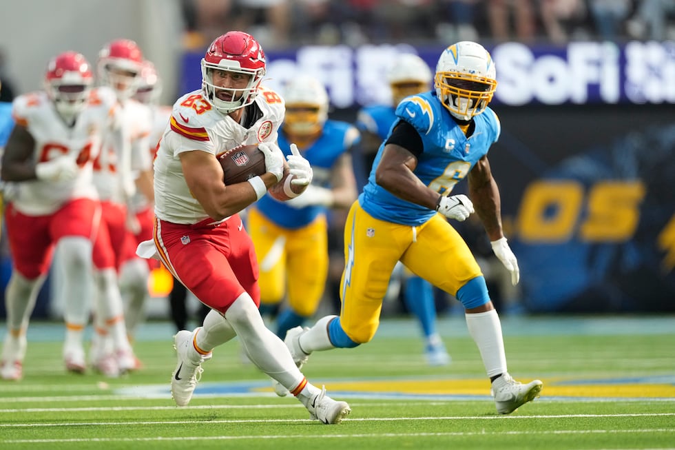 Kansas City Chiefs tight end Noah Gray (83) catches a pass as Los Angeles Chargers linebacker...