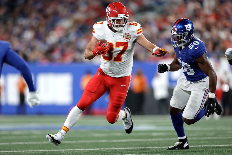 Kansas City Chiefs tight end Travis Kelce (87) runs with the ball as New York Giants inside...
