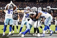 Dallas Cowboys defensive end Donovan Ezeiruaku (41) tackles Las Vegas Raiders running back...