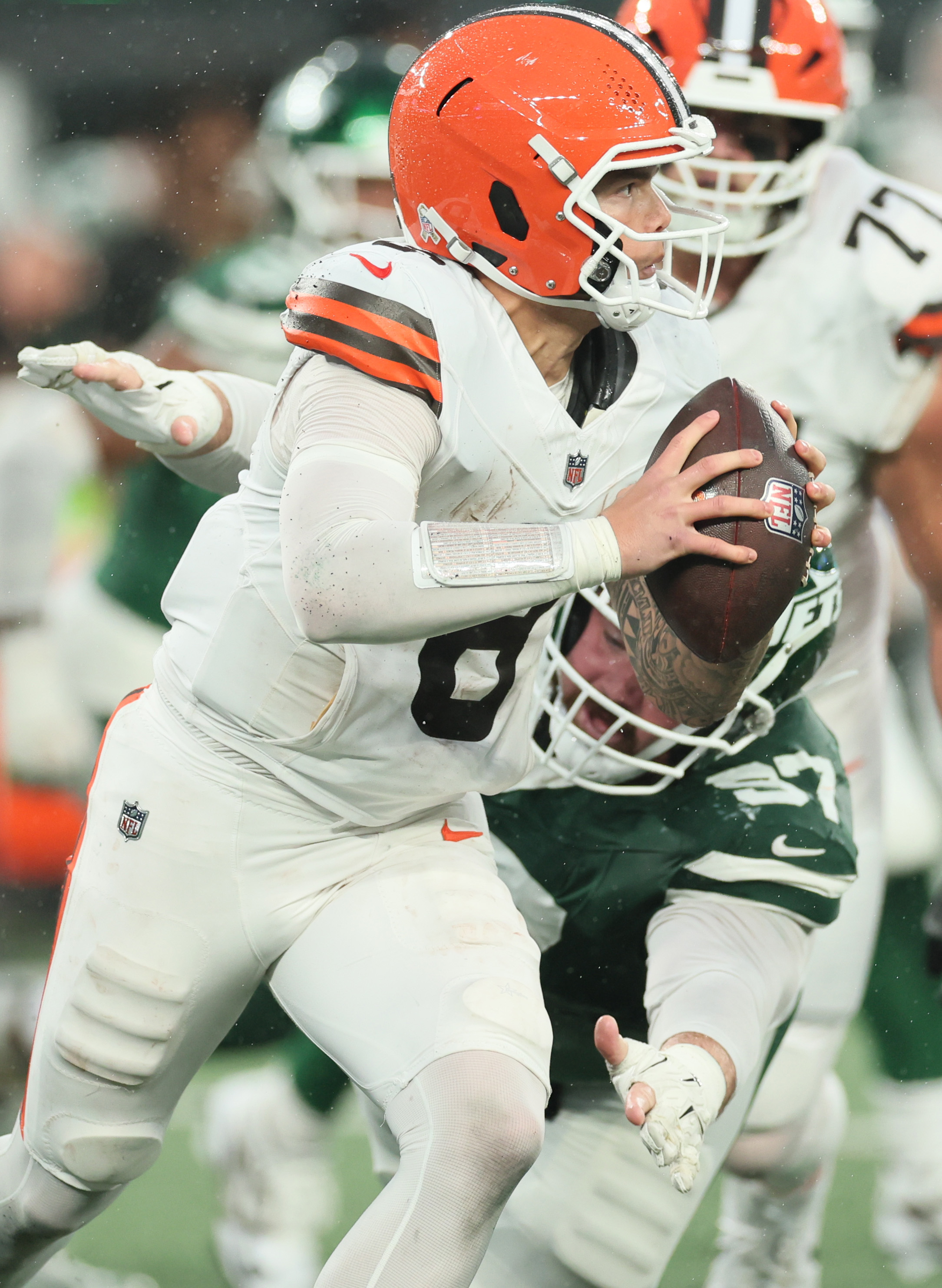 Cleveland Browns quarterback Dillon Gabriel scrambles out of the pocket from the pressure of New York Jets defensive tackle Harrison Phillips on a pass play in the second half.