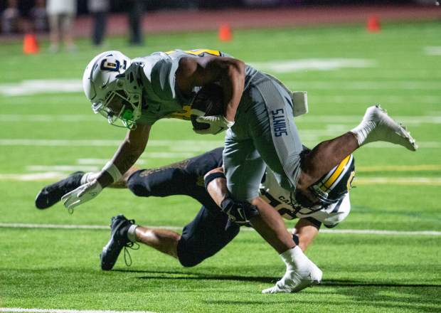 Crean Lutheran running back Caleb Bey breaks a tackle and gets across the goal line to score a touchdown during a nonleague game against Capistrano Valley on Friday, Sept. 5, 2025. (Photo by Jeff Antenore, Contributing Photographer)