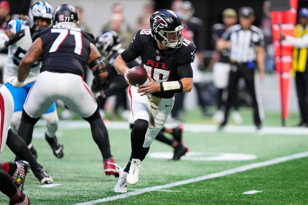 Atlanta Falcons quarterback Kirk Cousins (18) drops back in the second half of an NFL football...